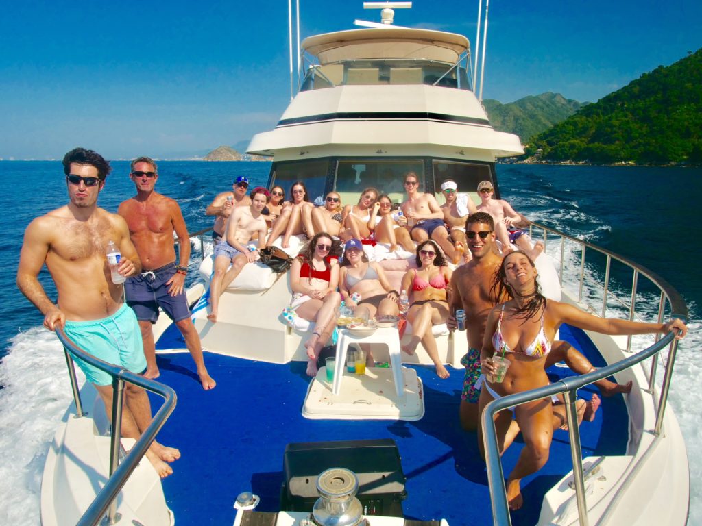 Large group of people enjoying yachting vacation